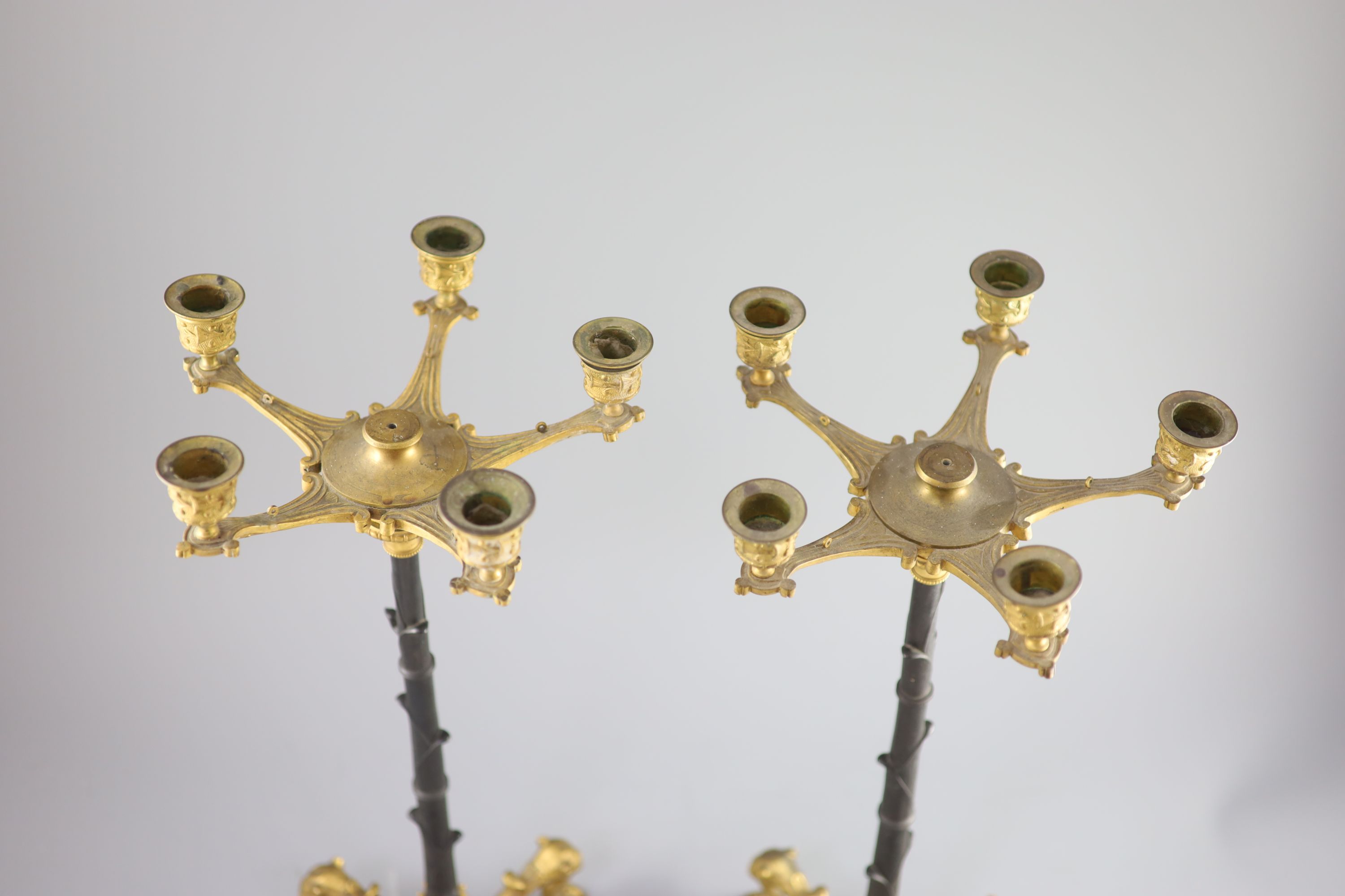 A pair of Barbedienne style five branch ormolu candelabra, 19th century, 52cm high